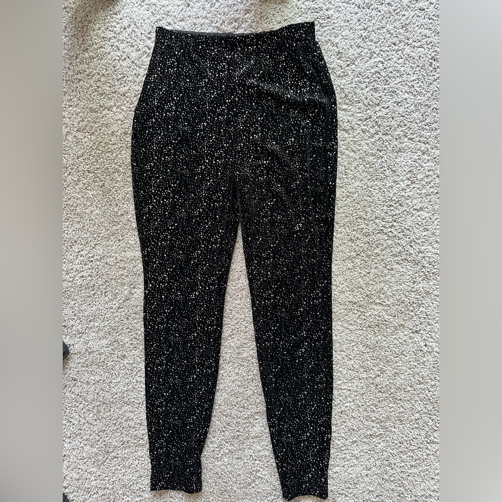 Black with shiny sparkles. Tube top and pants. Size small